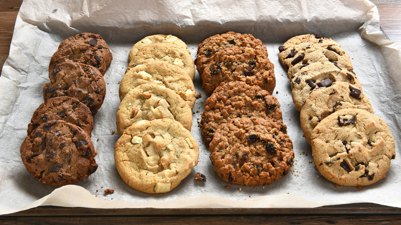 variety of cookies arranged on parchment paper