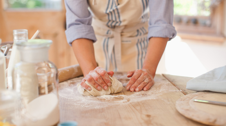 woman kneading dough