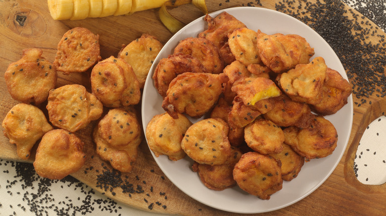 Fried plantain puffs on plate