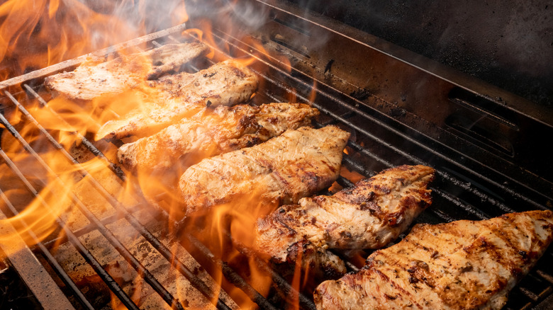 Chicken cooking on a grill