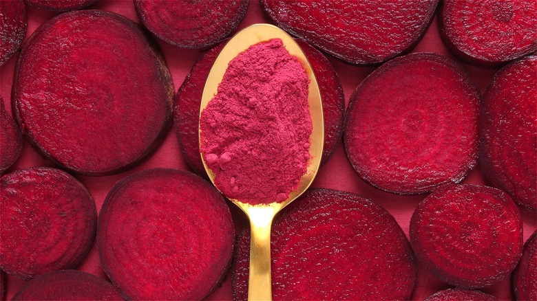 Beetroot powder on gold spoon 