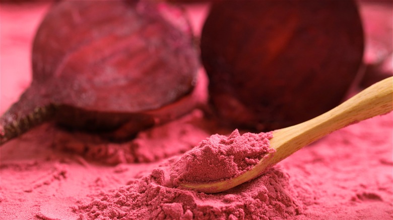 Beetroot powder on wooden spoon 