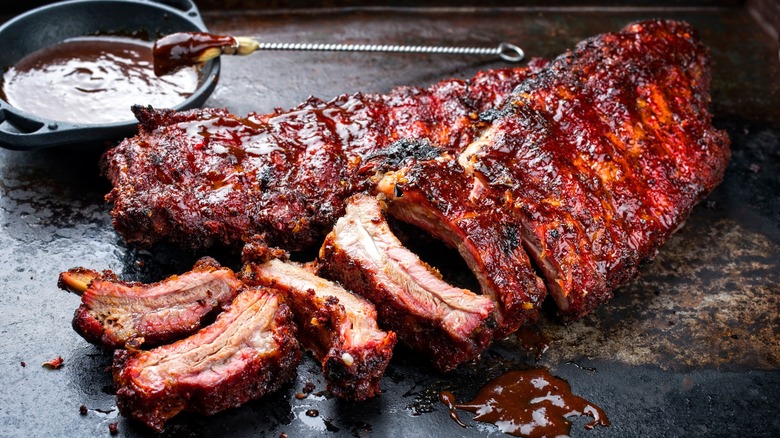 Grilled barbecue St Louis style ribs covered in sauce