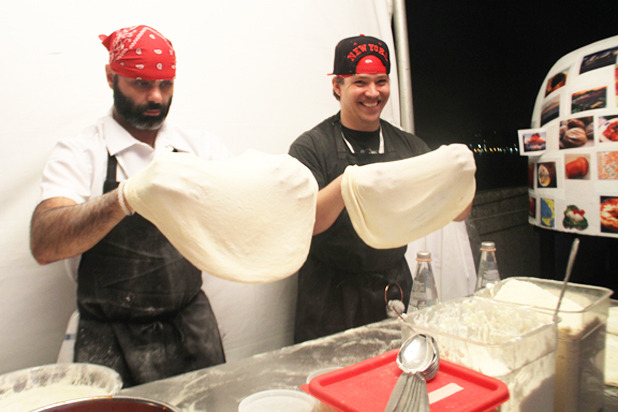 Pizza-Makers Stretching Out Dough