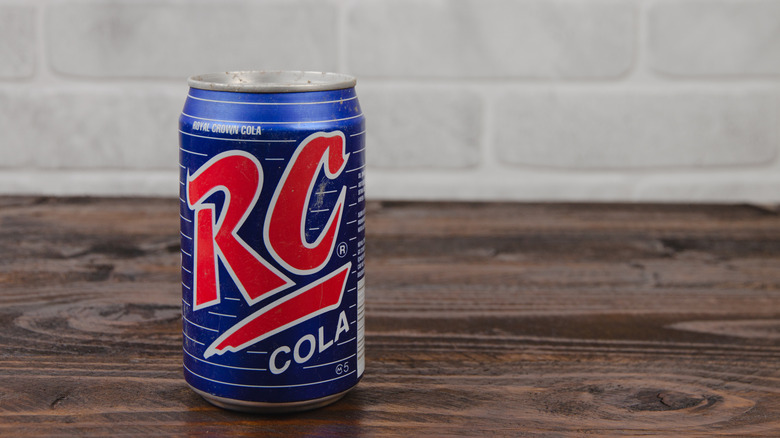 Can of RC Cola sitting on a wooden counter.