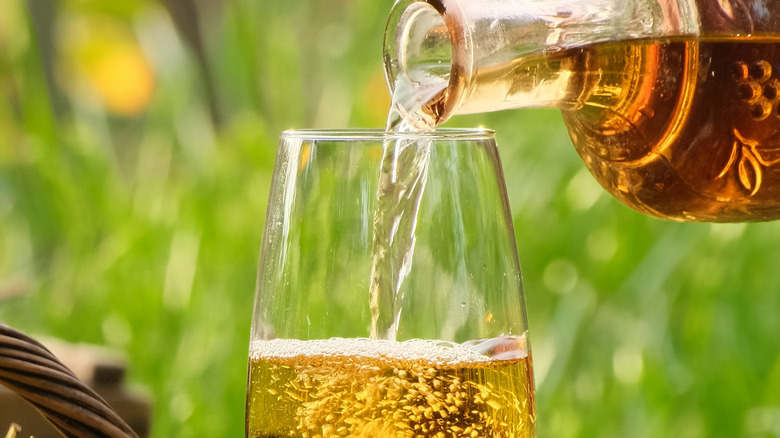 Homemade wine being poured into a glass