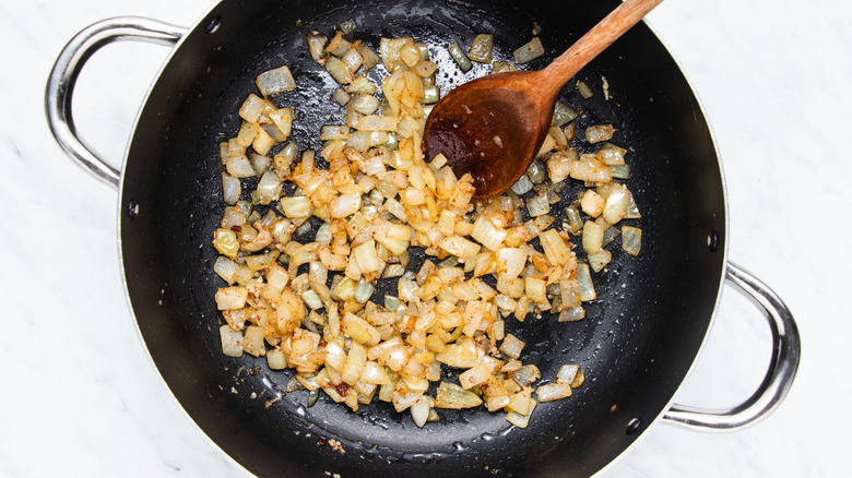 diced onion frying in pan 