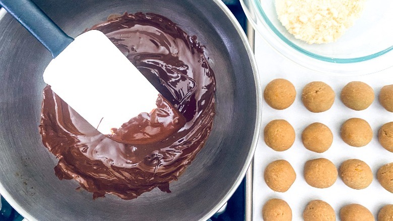 dipping cake balls in chocolate