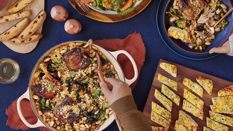 casserole dishes of blue apron food and tray of biscotti