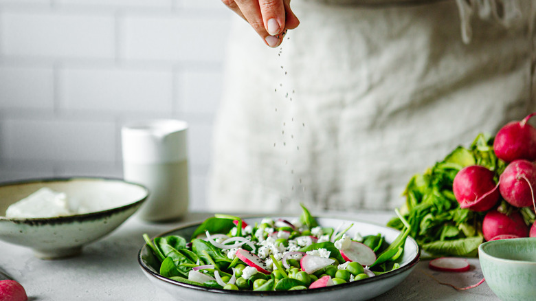 seasoning salad with salt