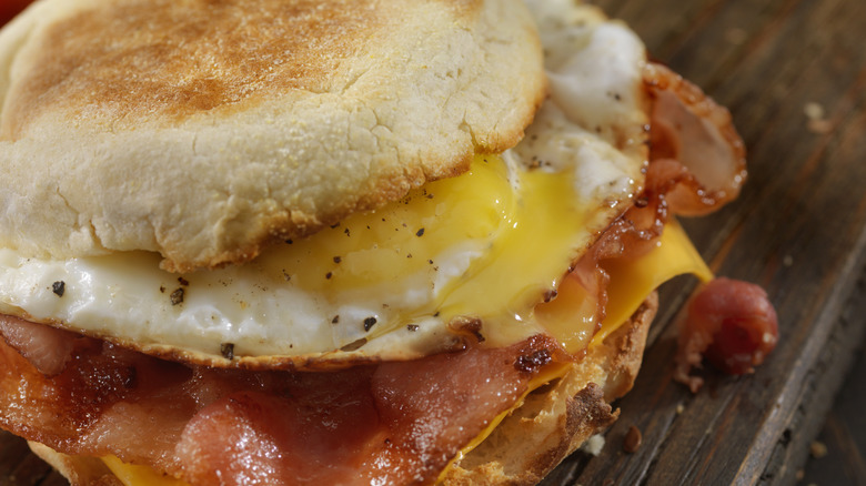 bacon, egg, and cheese breakfast sandwich on english muffin