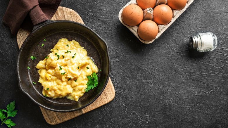 scrambled eggs in pan with ingredients