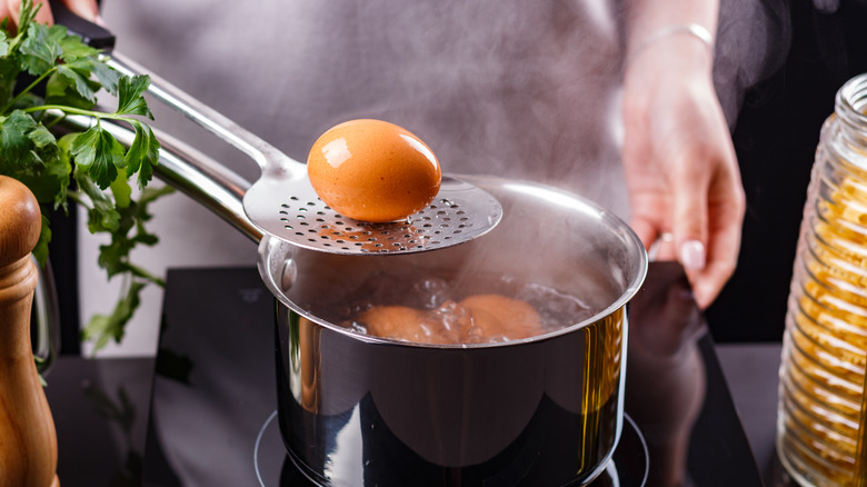 Person boiling eggs