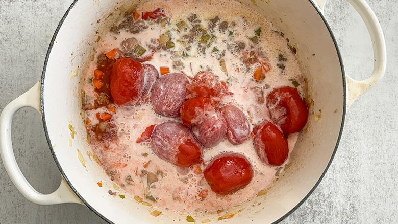 milk and tomatoes in bolognese sauce