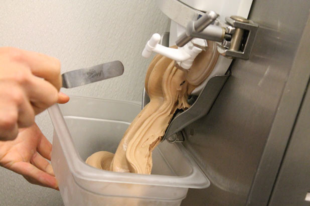 The ice cream coming out of the machine