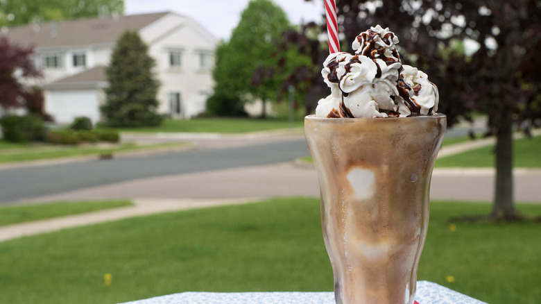 Root beer float with whipped cream and fudge drizzle