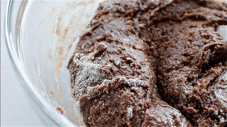 mixing flour into batter