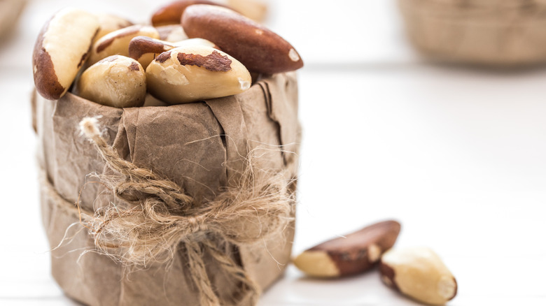 Brazil nuts in a paper wrapped jar