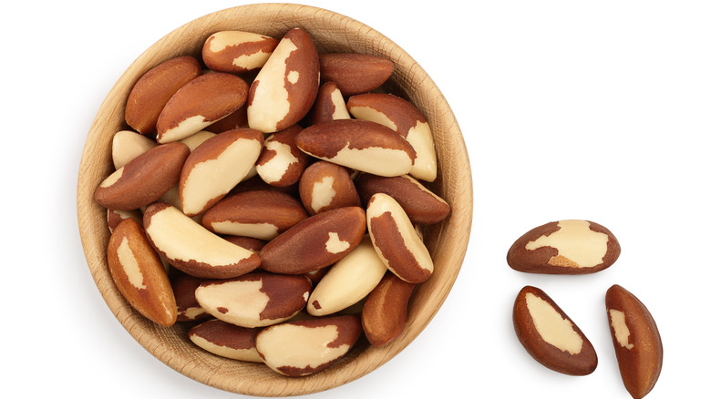 Brazil nuts in a bowl and on table