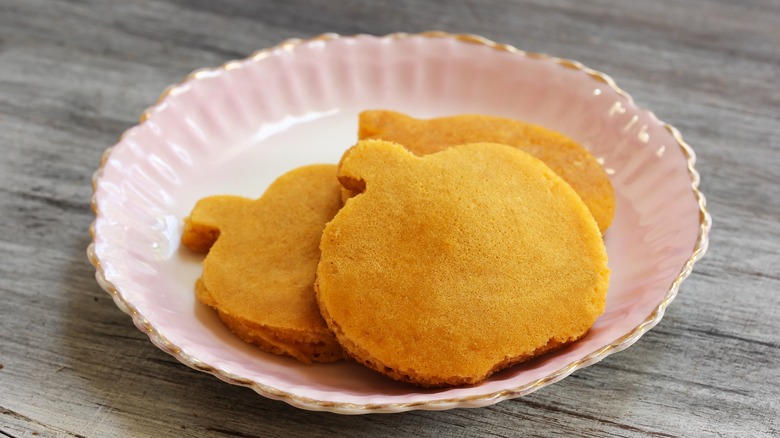 Pumpkin shaped pancakes on pink plate