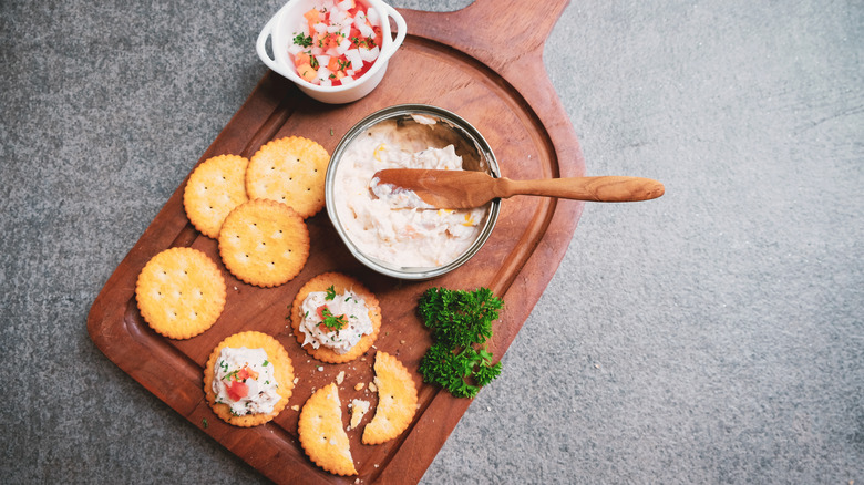 Tuna spread beside crackers