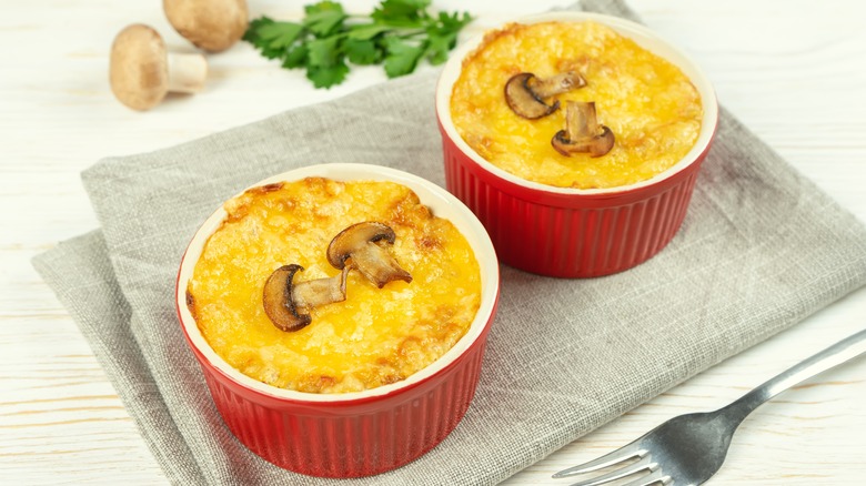 baked chicken mushroom cheese casserole in ramekins