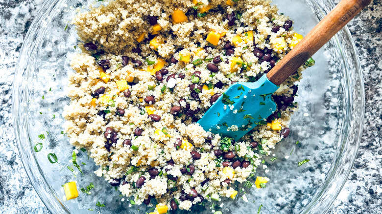 quinoa salad with rubber spatula