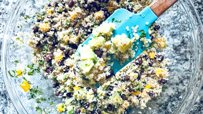 quinoa salad with rubber spatula