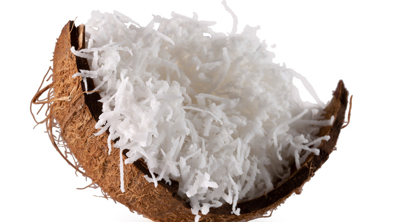 Coconut flakes on a coconut shell