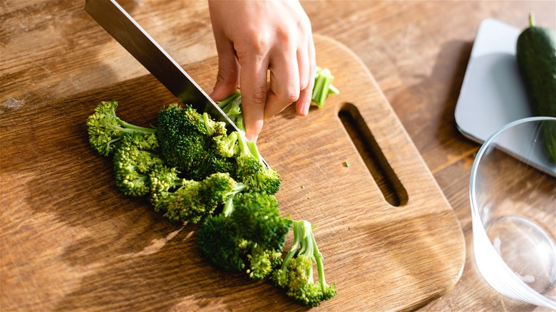 Chopped broccoli on cutting board 