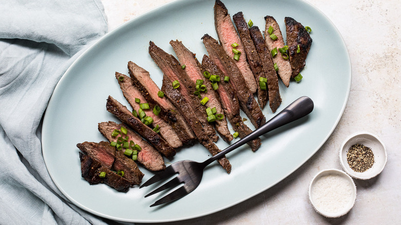 https://www.thedailymeal.com/img/gallery/broiled-flat-iron-steak-recipe/intro-1666708421.jpg