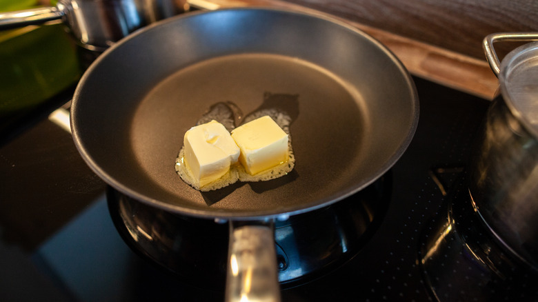 Butter in frying pan on stovetop