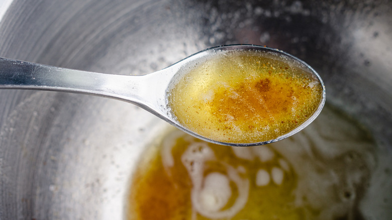 Browned butter in a spoon