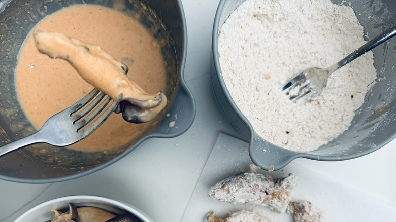 dipping mushroom in batter