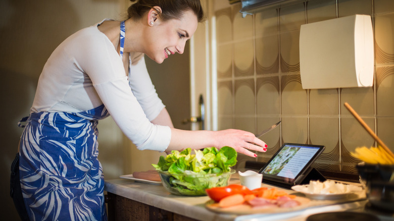 woman making a salad dressing with buttermilk