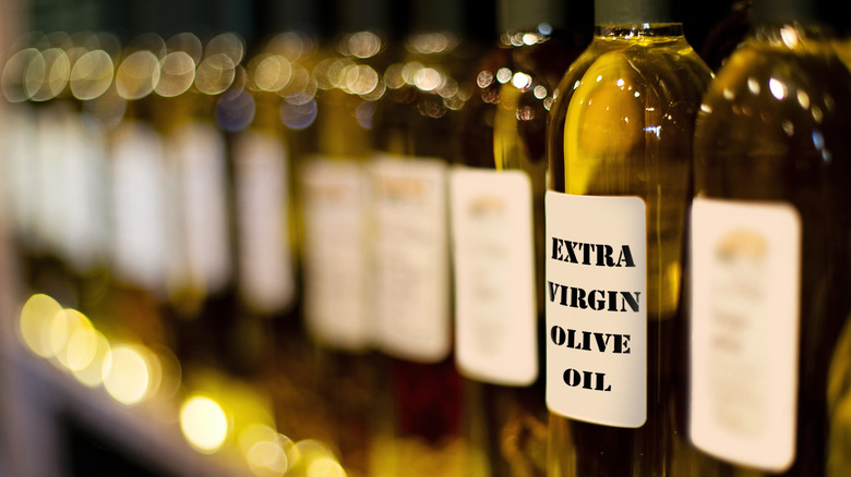 Bottles labeled extra virgin olive oil