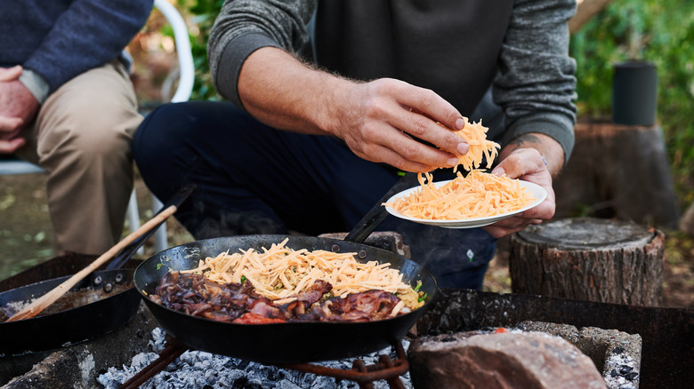 making campfire cheese dip