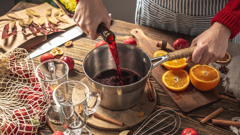 Person cooking mulled wine