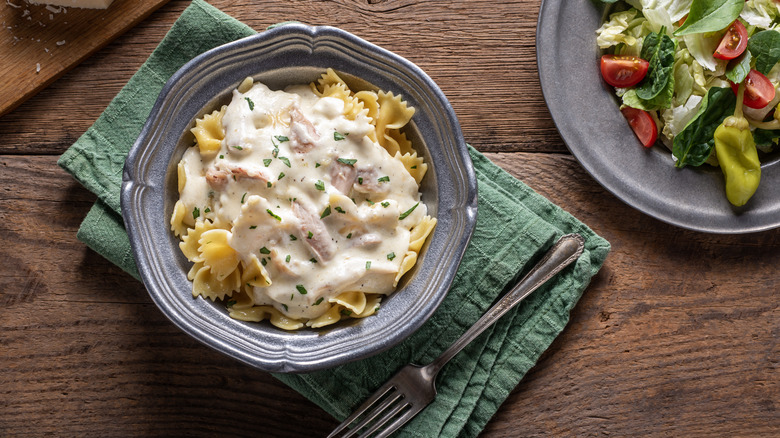 bowl filled with pasta sitting on top of green napkin