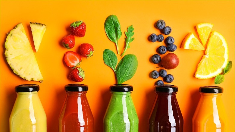 Bottles of fresh juice with fruit