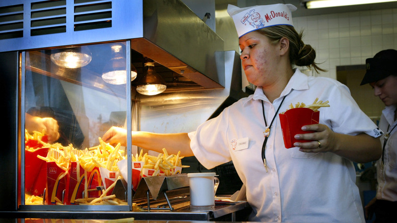 Woman serving fries