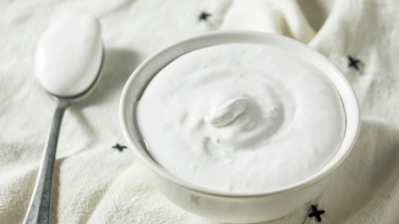 Marshmallow fluff on spoon and in bowl