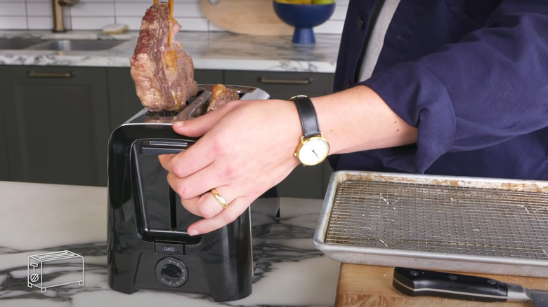 removing steak from toaster