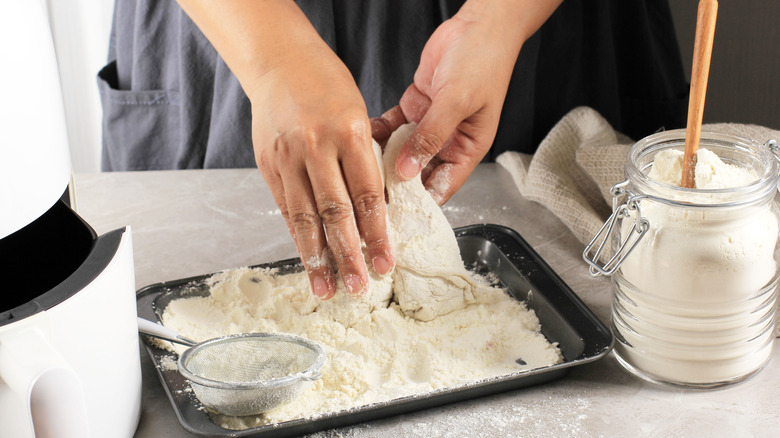 coating fried chicken in flour