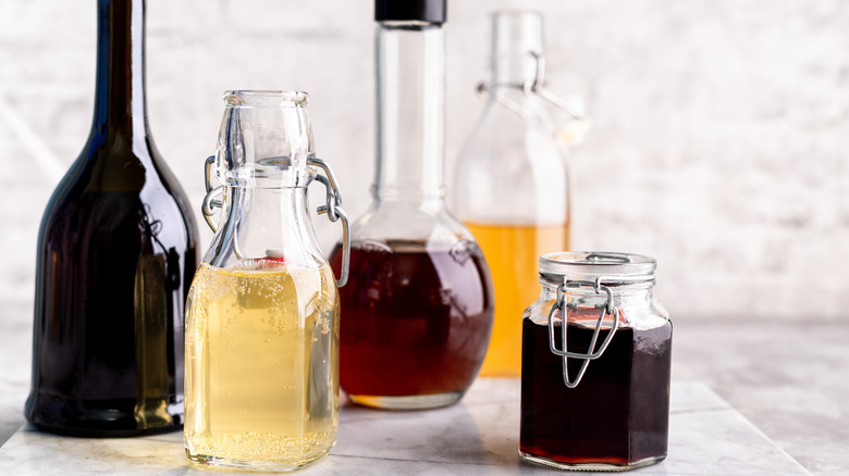 Vinegar bottles in different colors and sizes