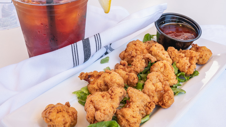 Fried alligator with red sauce