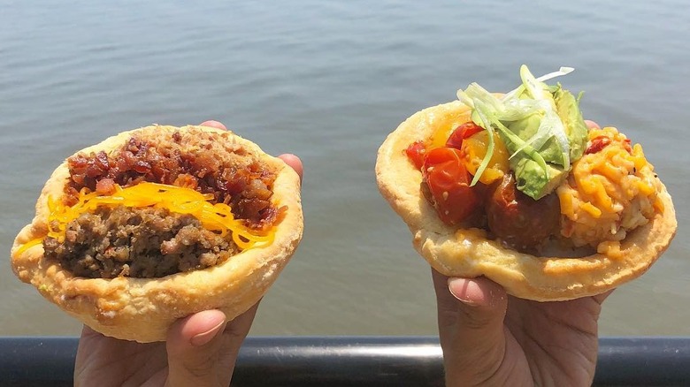 Filled biscuit bowls hoisted in air