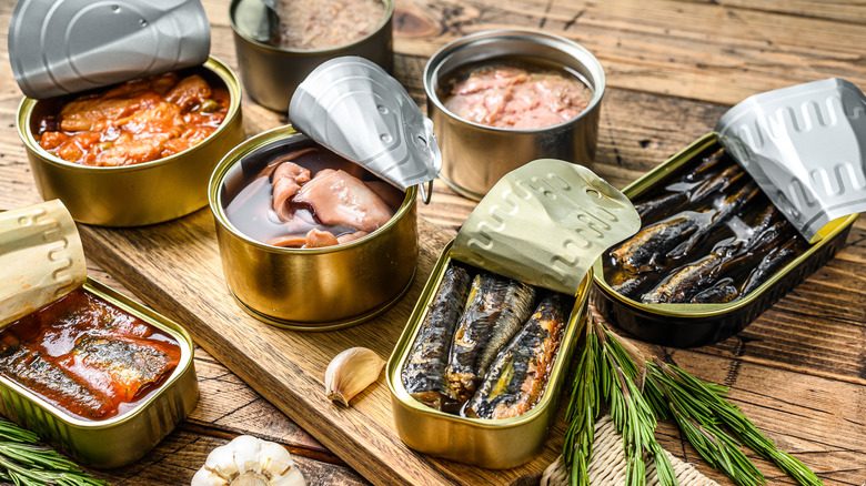 Tinned fish on a wooden table