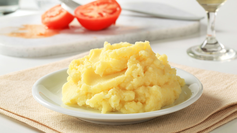 Plate of mashed potatoes tomatoes