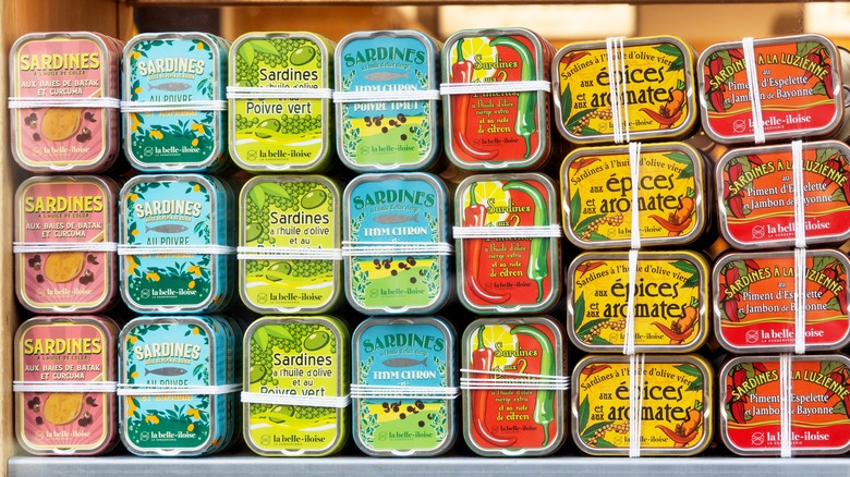 Colorful display of sardine cans in a shop window